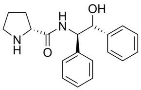 (2R)-N-[(1R,2R)-2-Hydroxy-1,2-diphenylethyl]-2-pyrrolidinecarboxamide